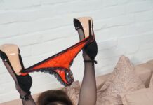 Marie Duval wears some black stockings and sexy red panties for us