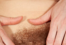 Eva Strawberry pulls her pussy lips aside and shows us her pink pussy