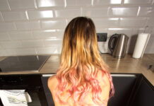 Elena Muze is in the kitchen spreading her legs open to show her pussy in VR