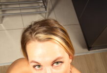 Elena Muze is in the kitchen spreading her legs open to show her pussy in VR