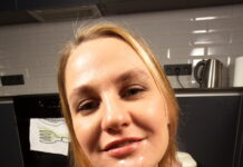 Elena Muze is in the kitchen spreading her legs open to show her pussy in VR